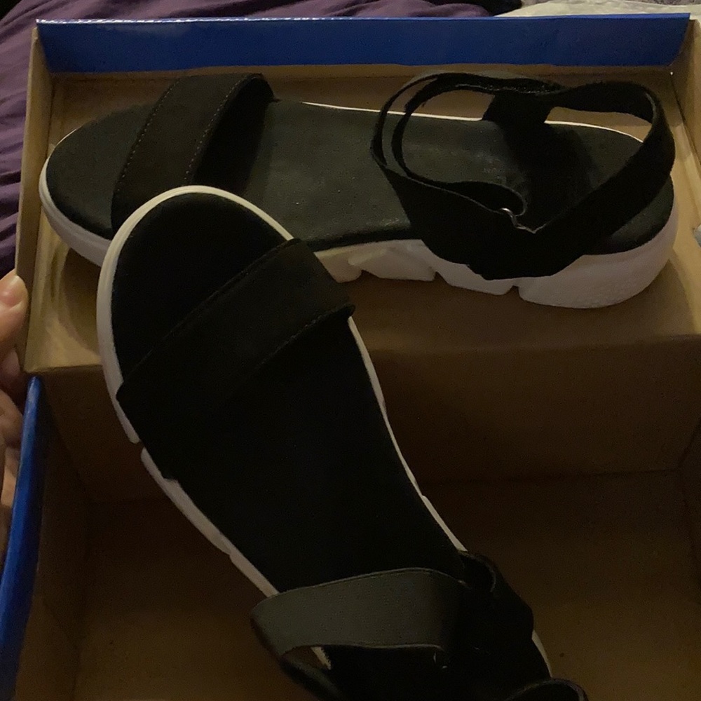 Black and white sandals with a suede type fabric